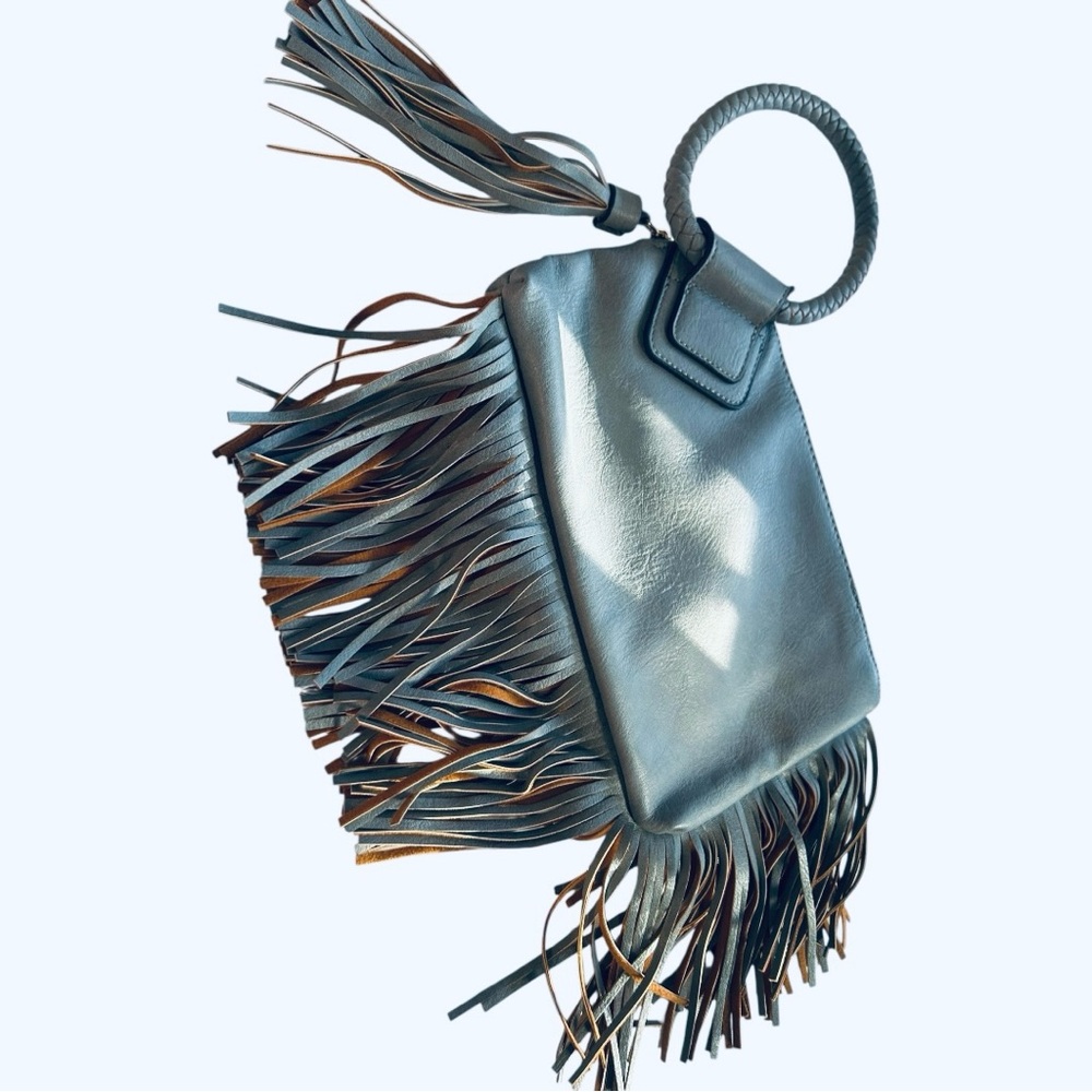 NWOT Unbranded grayish blue faux leather fringe bag with circular handle
